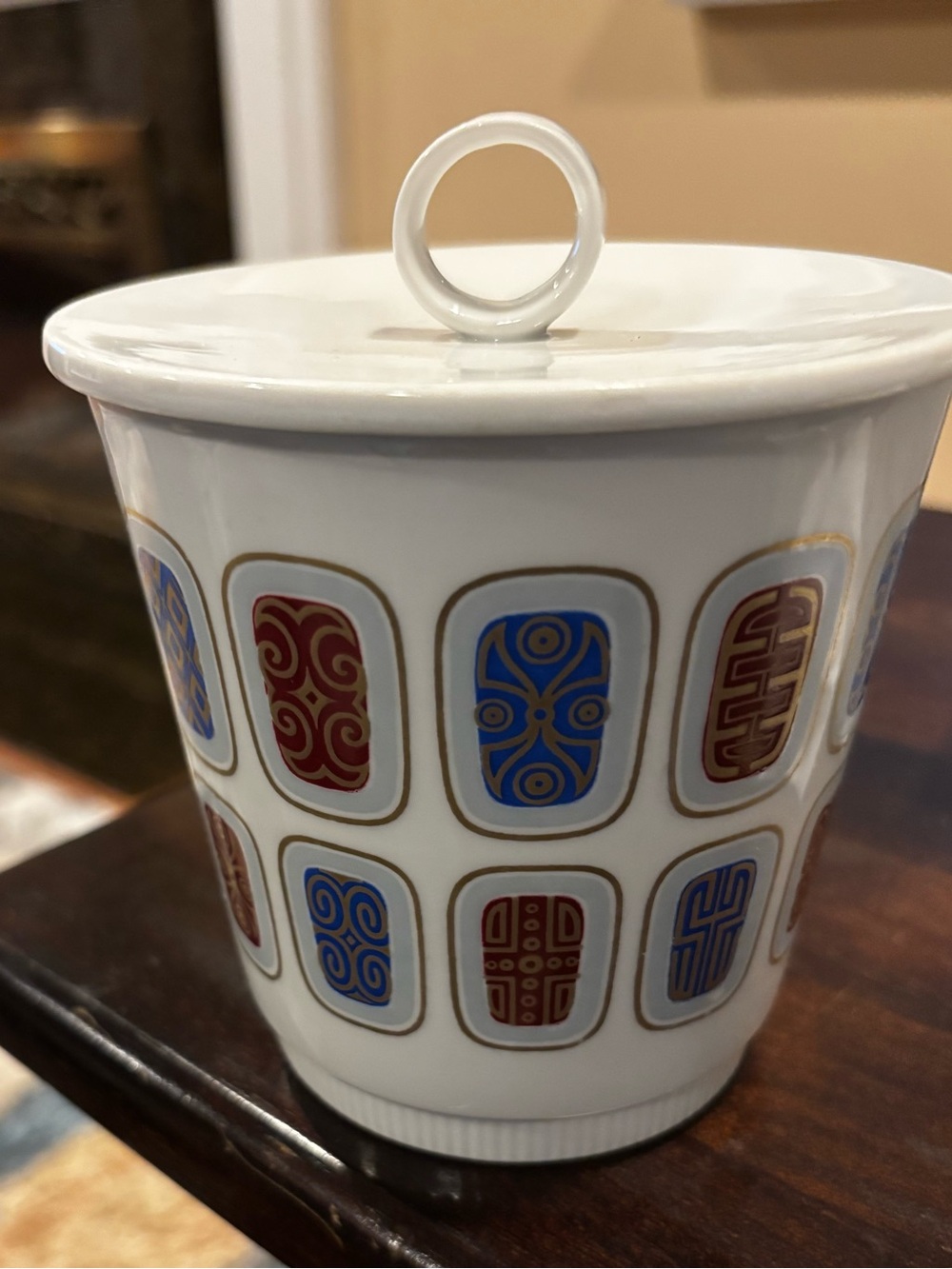 This is a vintage mid-century modern lidded porcelain jar made by Alka
